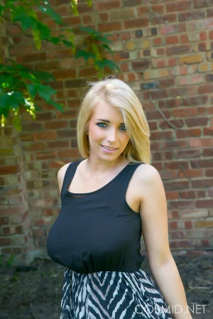 Busty-blonde-gets-naked-outdoors-01