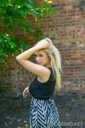 Busty-blonde-gets-naked-outdoors-02