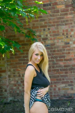 Busty-blonde-gets-naked-outdoors-05