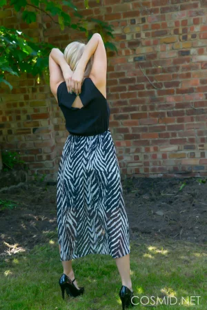 Busty-blonde-gets-naked-outdoors-06