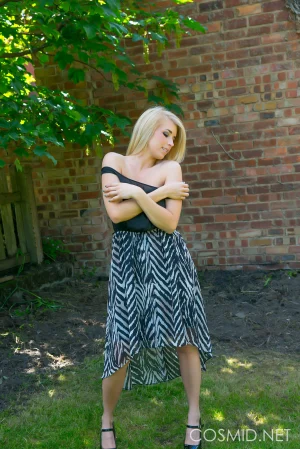 Busty-blonde-gets-naked-outdoors-07