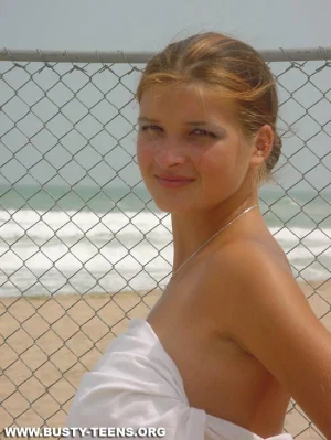 03-teen-shows-her-huge-jugs-on-the-beach