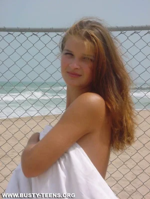 05-teen-shows-her-huge-jugs-on-the-beach